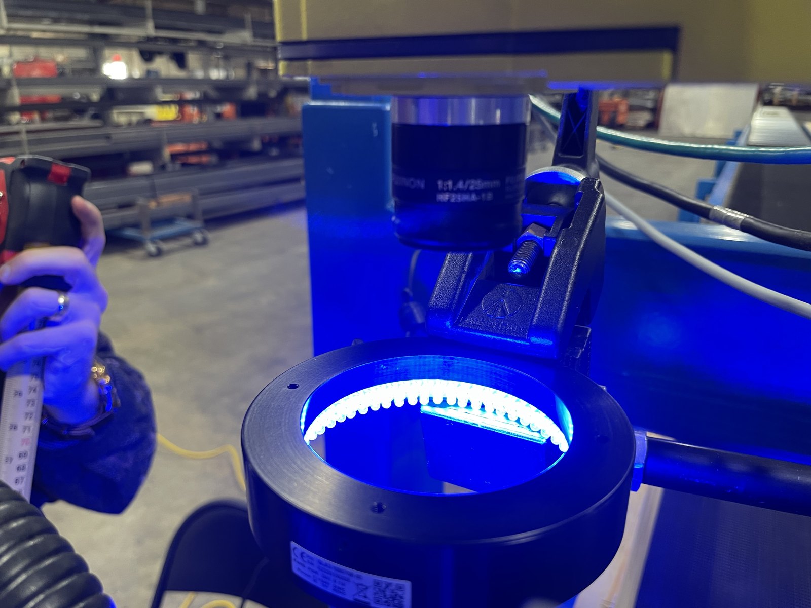 Ring-lit machine vision head mounted over the line looking down at the board