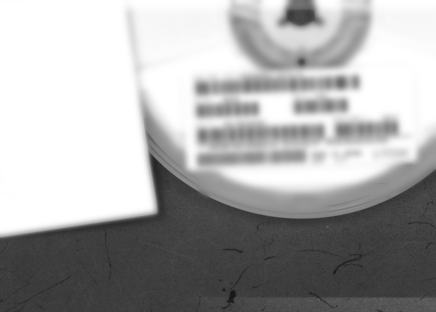 Component reel with a landscape label and multiple barcodes; label text blurred