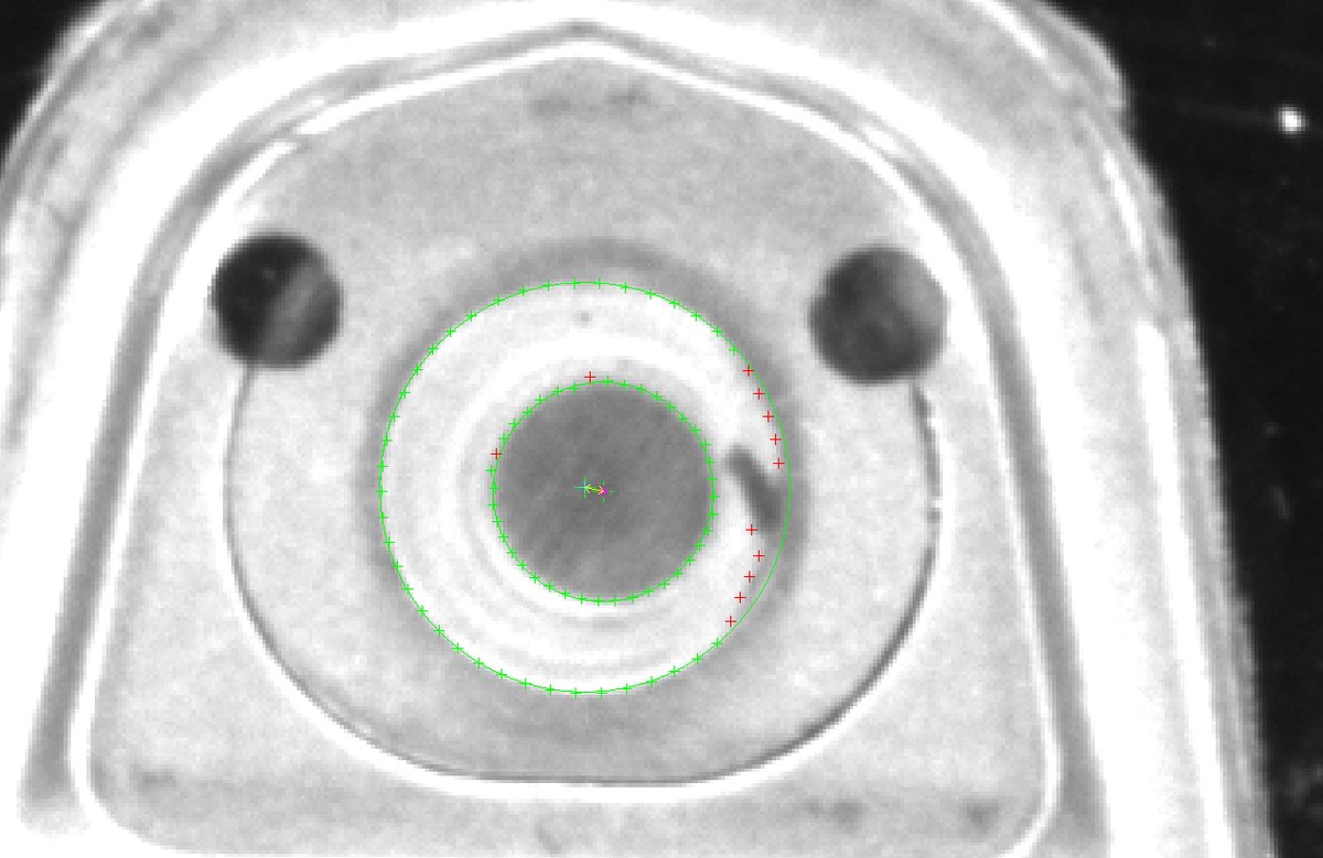 Vision inspection of a can end showing the opening rivet offset and failing