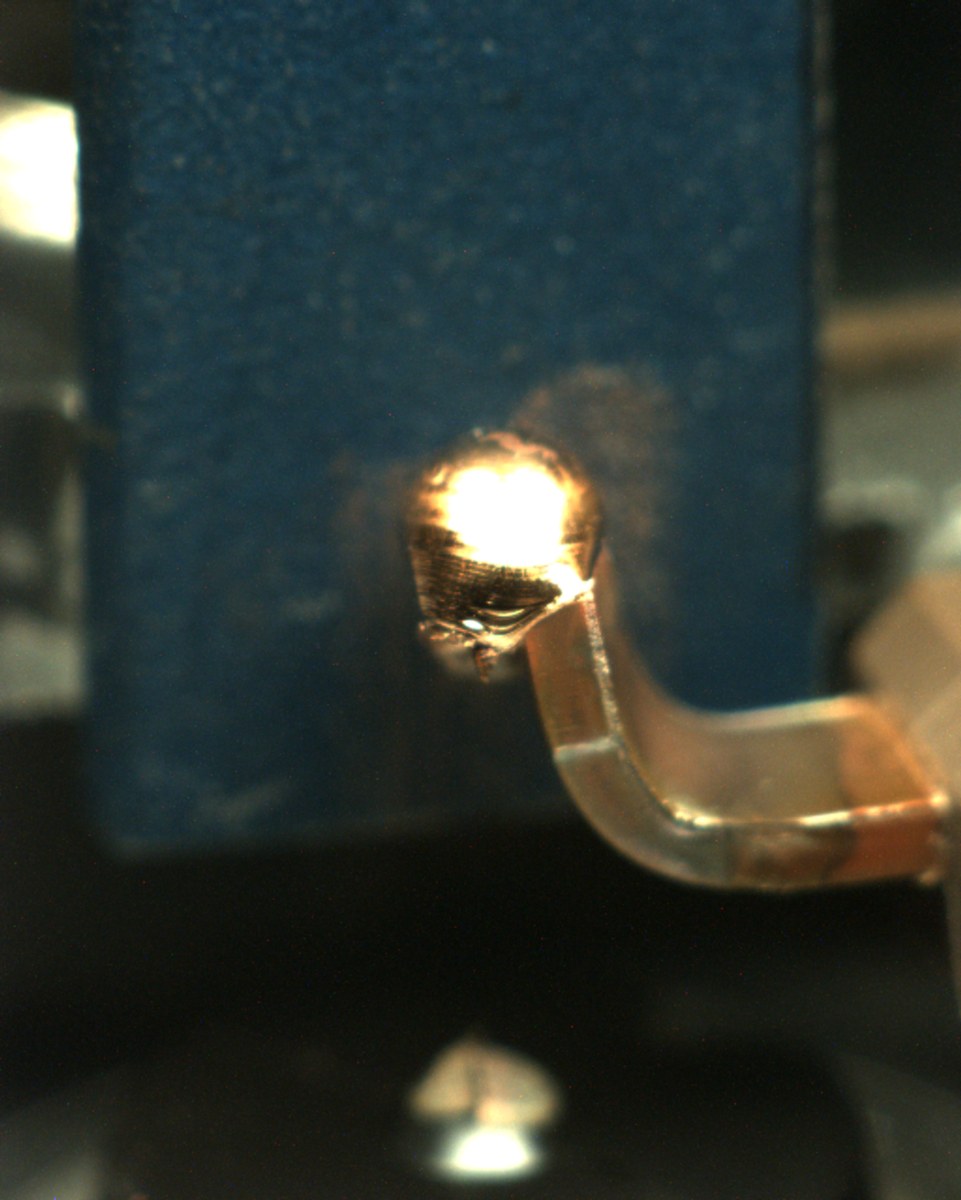 A weld bead with a pit or crater in its surface, flagged by the classifier