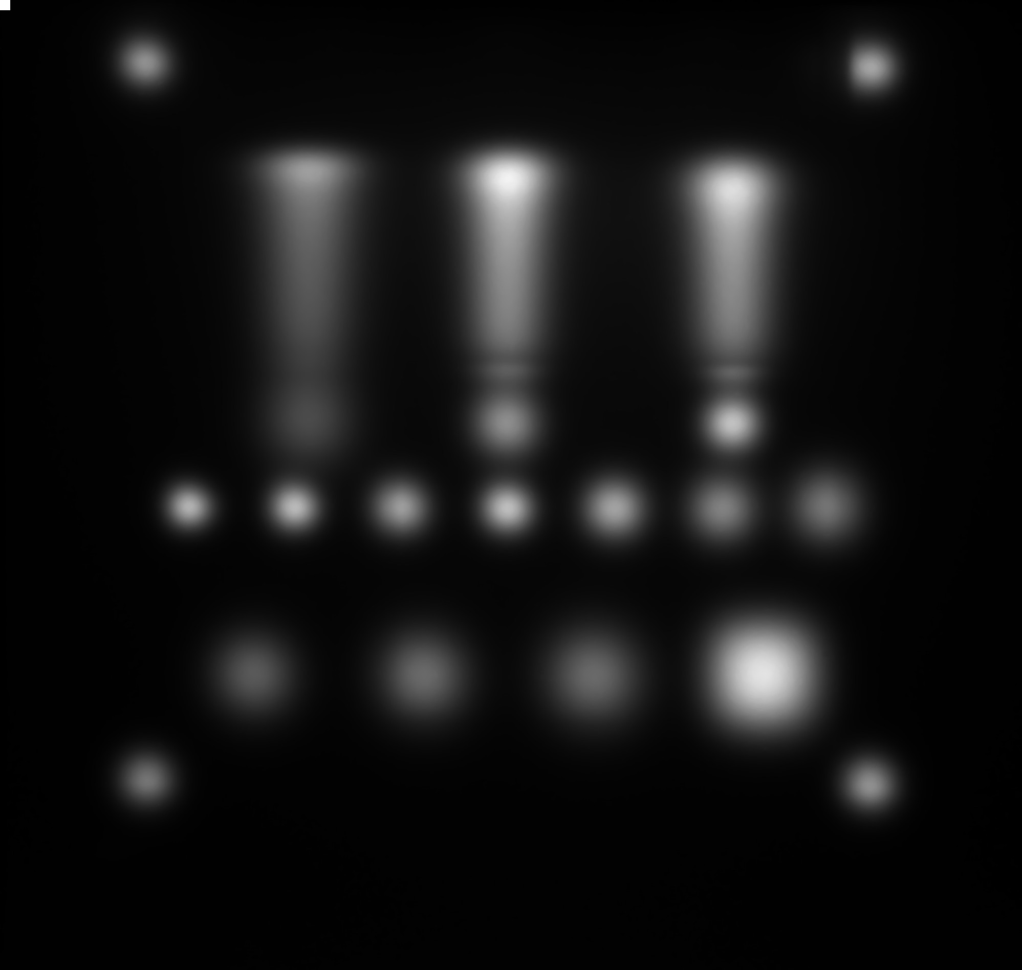 Actual scintillation light measurement showing three Bragg peaks behind the energy-degrading wedges, with the surrounding spot grid used for sub-millimeter position analysis.